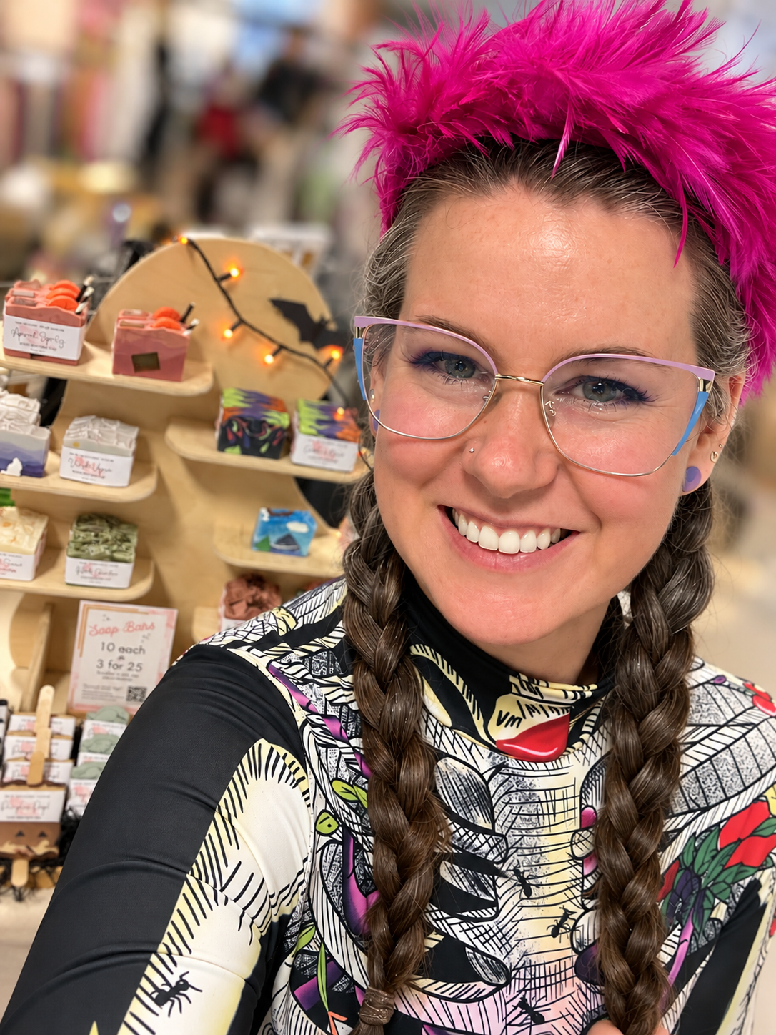 Tiff, the maker behind Eccentric Flamingo, at her market booth with her handmade soaps