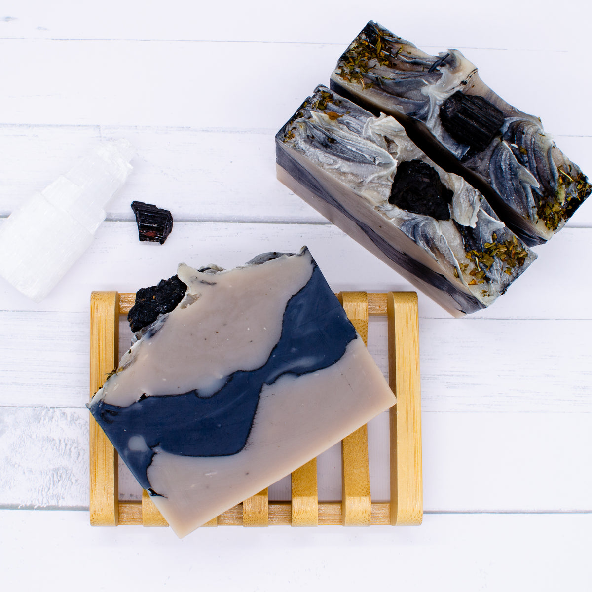 Tempest Soap: indigo-colored natural soap bar topped with a piece of black tourmaline
