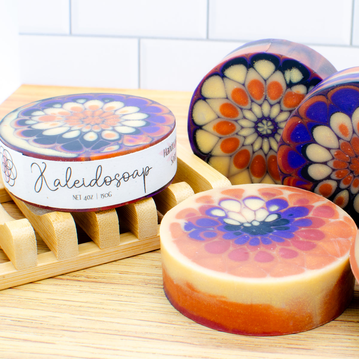 Kaleidosoap No. 29: one-of-a-kind soap in pumpkin orange, gold, purple, red, and black with gold shimmer