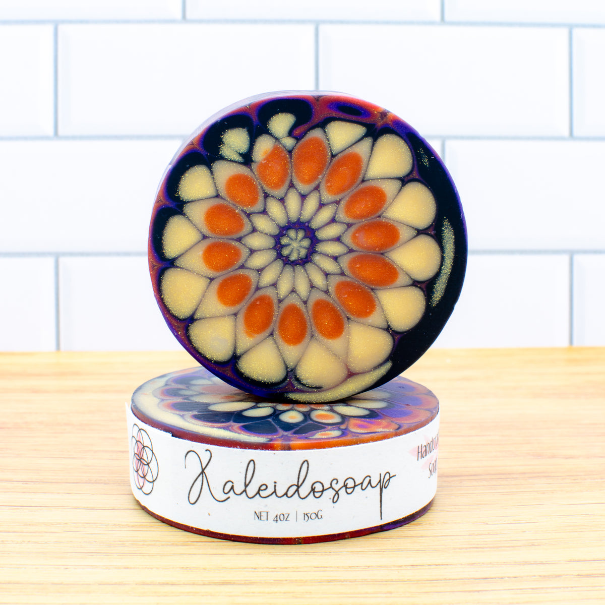 Kaleidosoap No. 29: one-of-a-kind soap in pumpkin orange, gold, purple, red, and black with gold shimmer (photo 2)