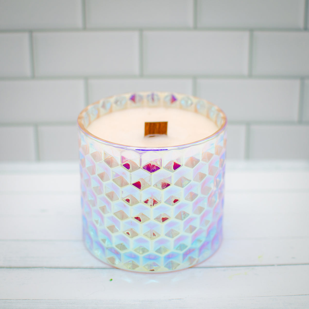 PRISM Candle - Blush: pink soy wax candle in an iridescent glass jar, peach and peony scent