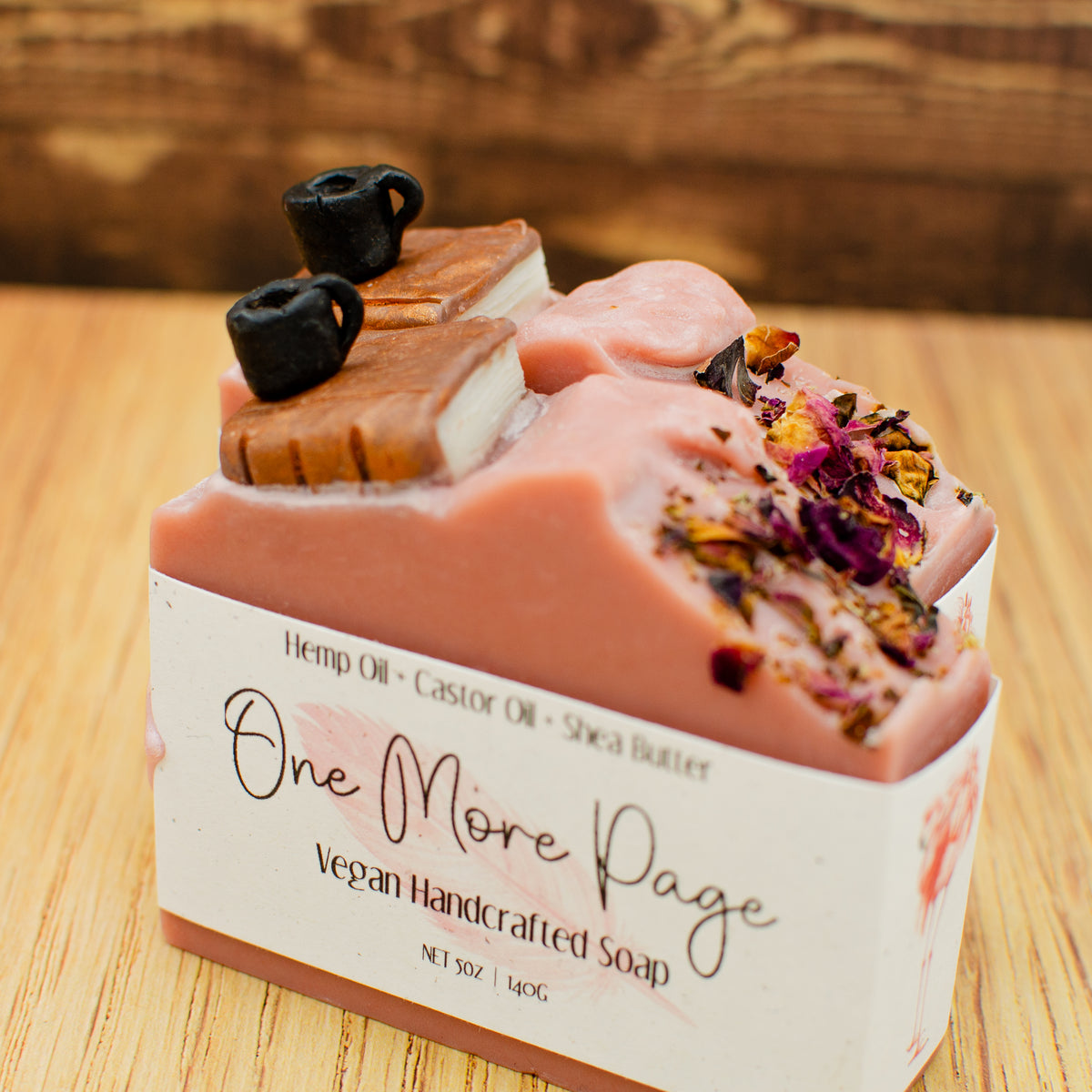 One More Page Soap: coffee and leather soap bar topped with a sculpted soap book, coffee cup, and rose petals (photo 5)